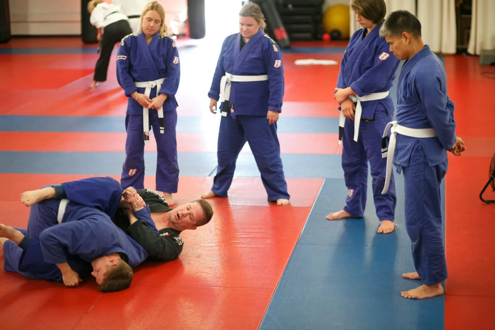 Professor Justin Tevis explains a Kimura arm lock to the beginner Brazilian Jiu-Jitsu class